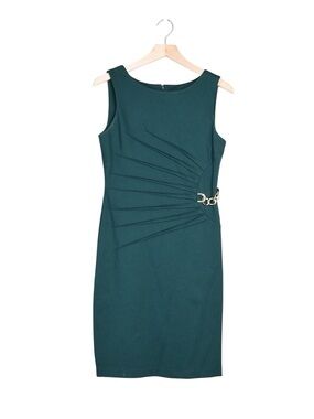 ivanka trump green dress wears forest outfit and matching hat at Donald Trump inauguration Ivanka Trump shines in Johanna